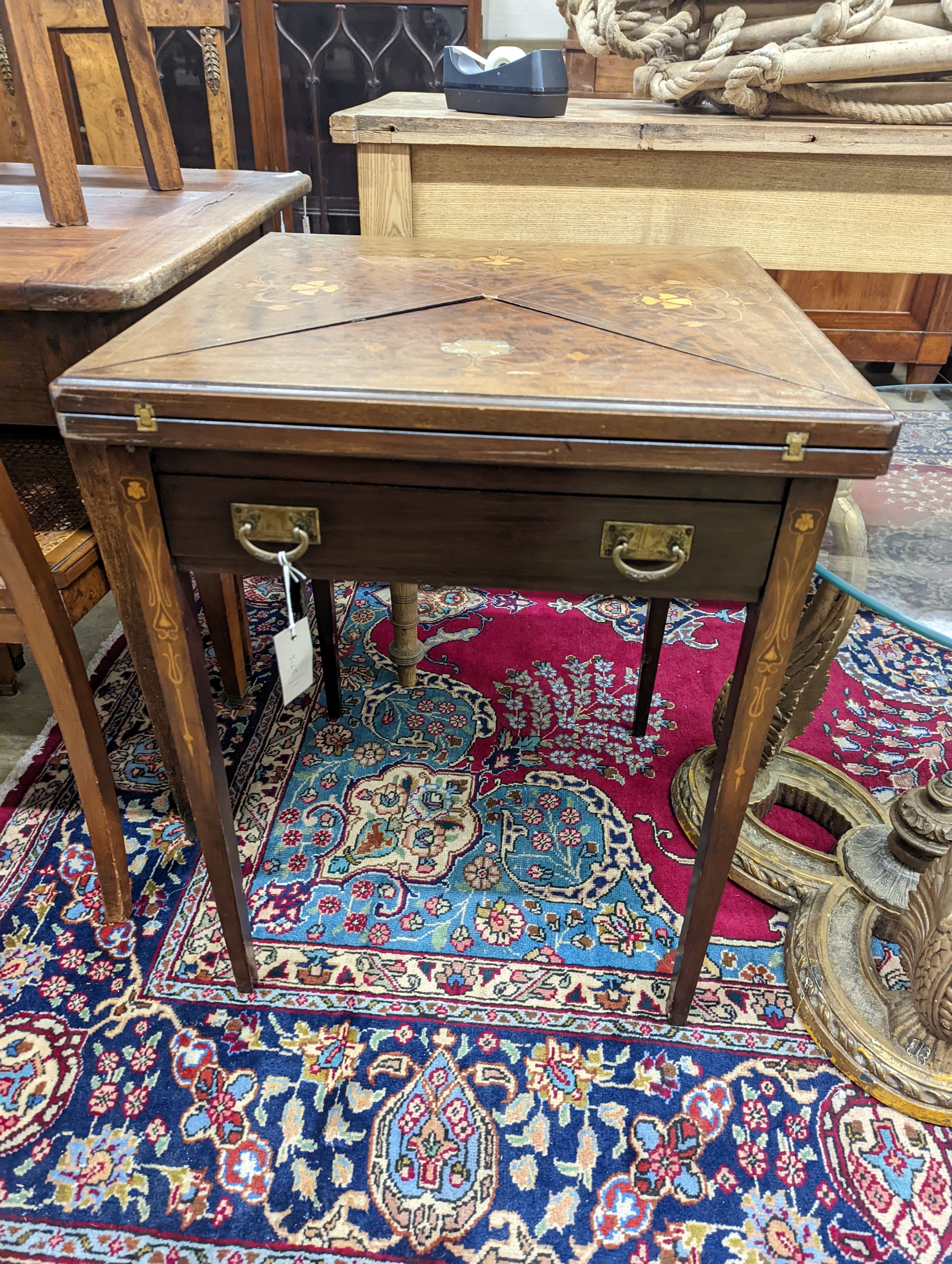 An Edwardian Art Nouveau mahogany and marquetry envelope card table. W-56, D-56cm, H-73cm.